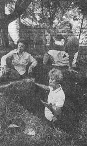 a vintage photo of a group of people posing for the camera