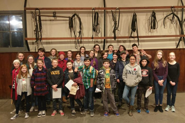 a group of people posing for the camera