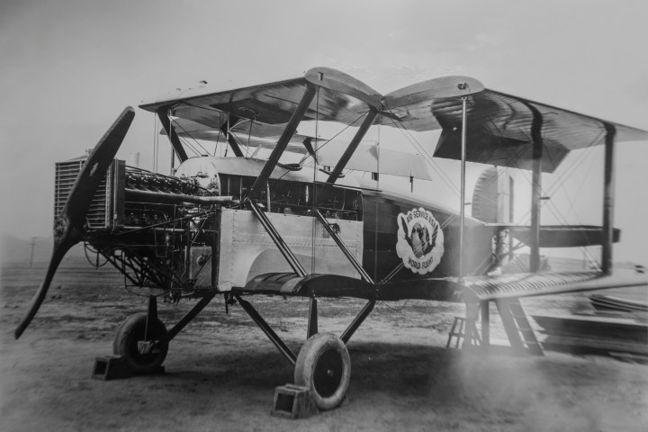 a small plane sitting on top of an old airplane