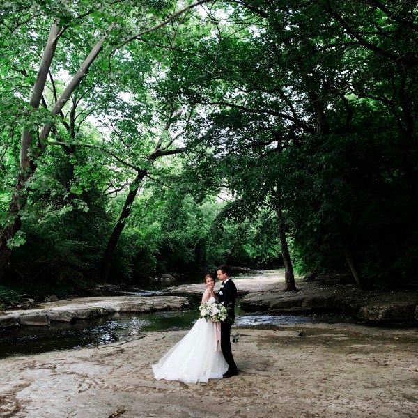 a person standing next to a tree