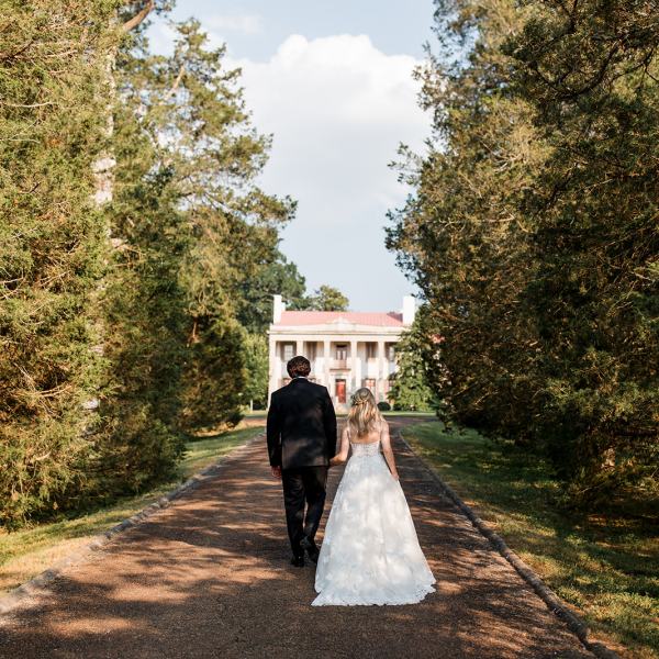 a person riding a bike down a dirt road