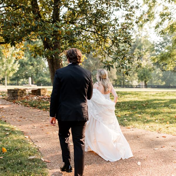a man standing next to a tree