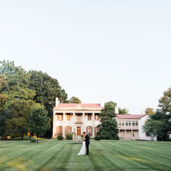 a tree in front of a house