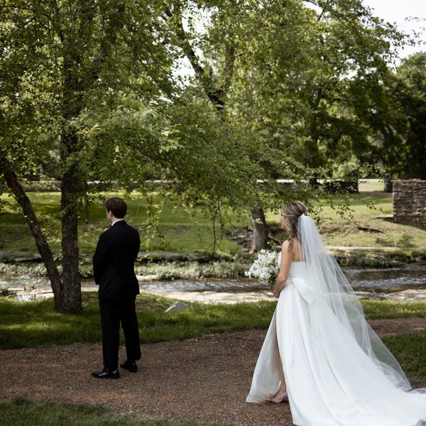 a man standing next to a tree